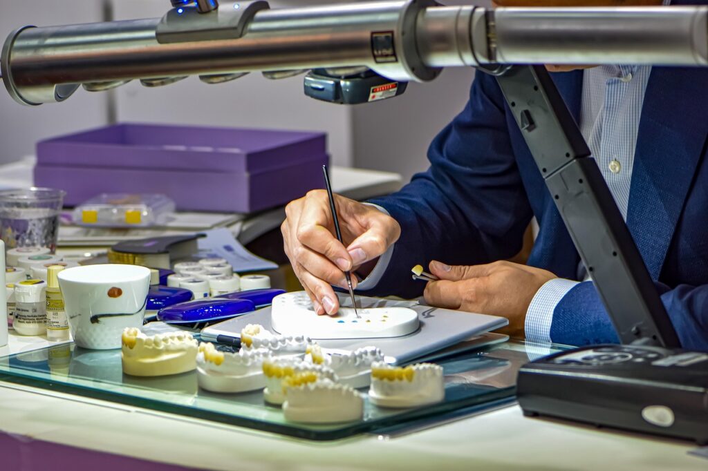 dental laboratory technician crafting dental prosthetics in Bangalore