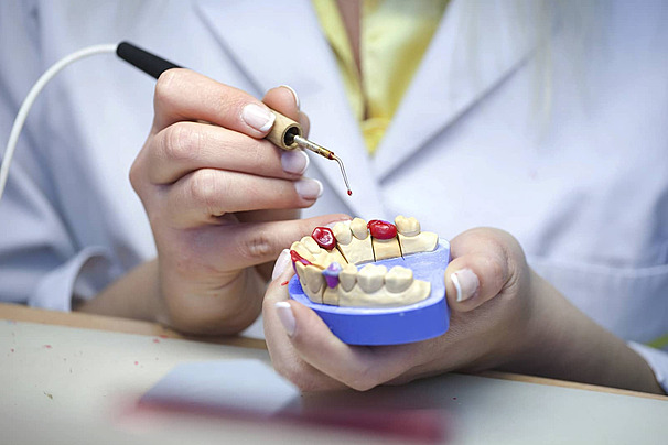 dental laboratory technician crafting dental prosthetics in Bangalore